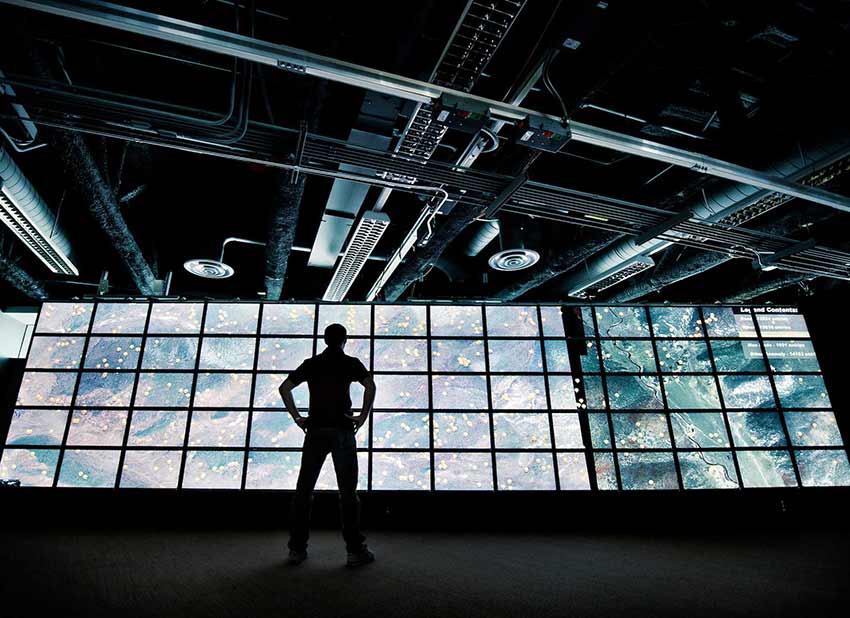 UC San Diego researcher looking at weather satellite images.